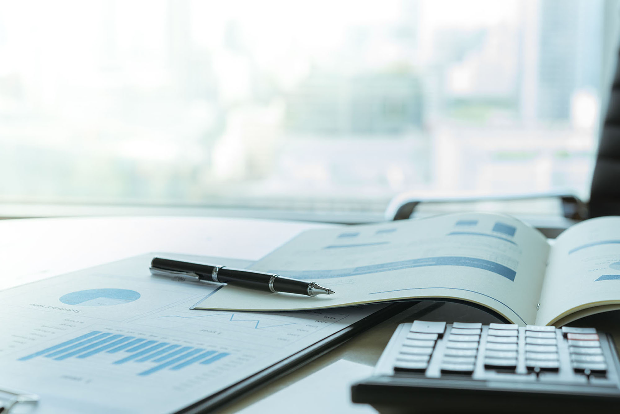 A financial report and business plan on a desk